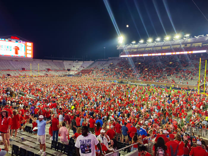 Ole Miss fans celebrate Saturday's Magnolia Bowl win by storming the field at Vaught-Hemingway Stadium.
